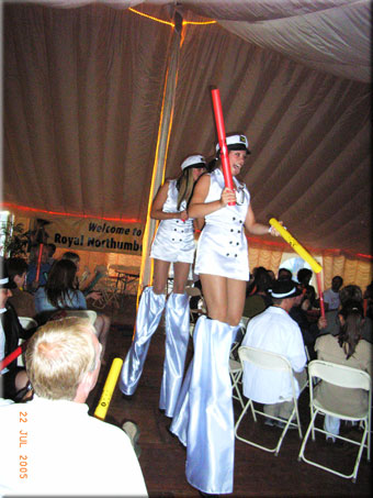Two stilt dancers join in the Boomwhacker rhythmical excitement.